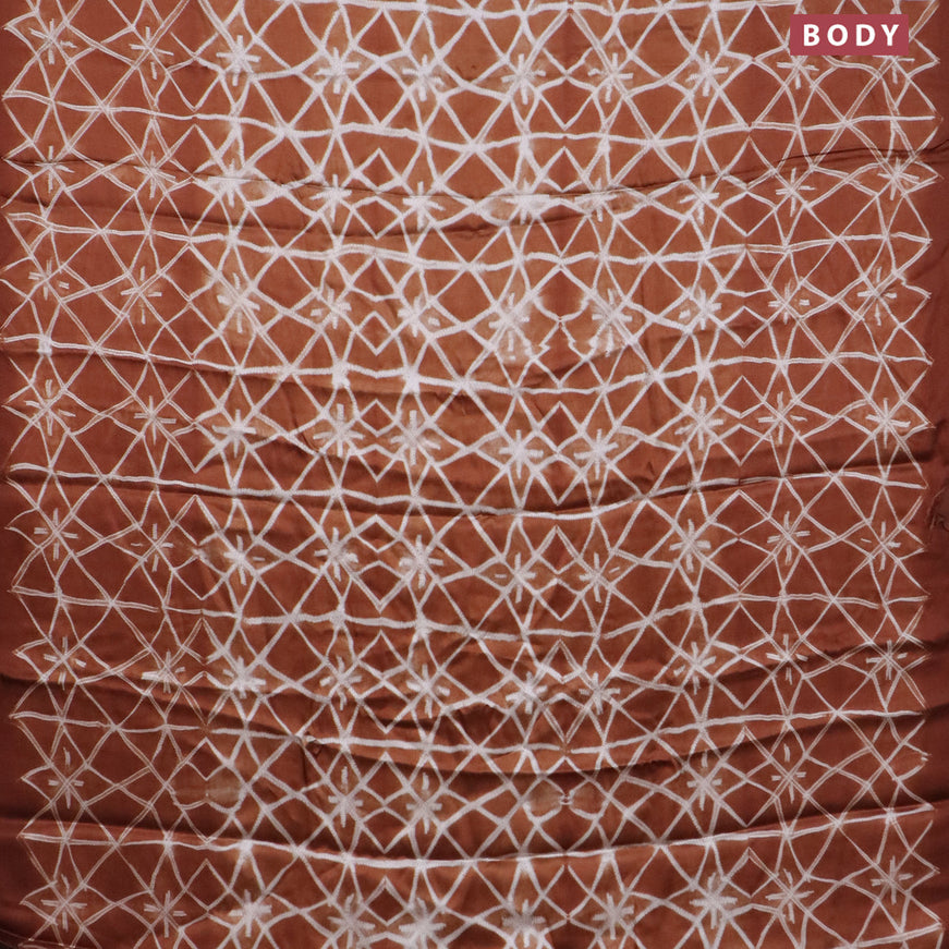 Modal silk saree rust shade with allover prints and printed border