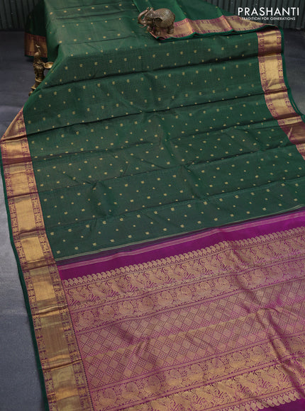 Pure kanchipuram silk saree dark green and purple with allover small zari checks & annam buttas and zari woven border