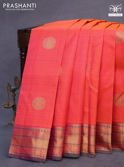 Pure kanchipuram silk saree dual shade of pinkish orange and dual shade of greenish purple with allover self emboss & zari buttas and rich zari woven border