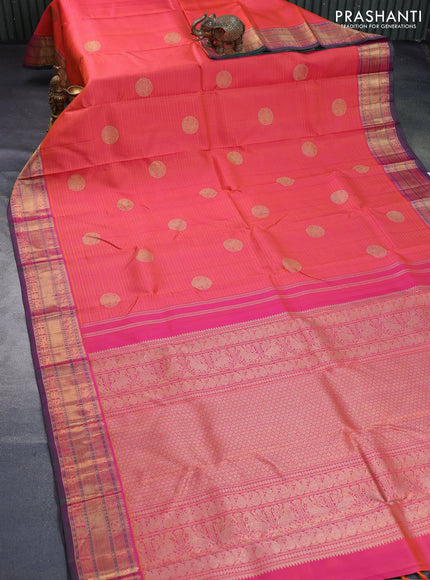 Pure kanchipuram silk saree dual shade of pinkish orange and dual shade of greenish purple with allover self emboss & zari buttas and rich zari woven border