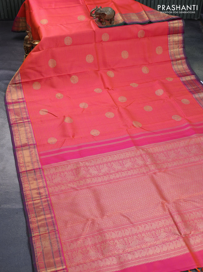 Pure kanchipuram silk saree dual shade of pinkish orange and dual shade of greenish purple with allover self emboss & zari buttas and rich zari woven border