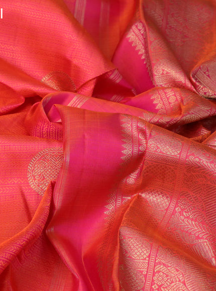 Pure kanchipuram silk saree dual shade of pinkish orange and dual shade of greenish purple with allover self emboss & zari buttas and rich zari woven border