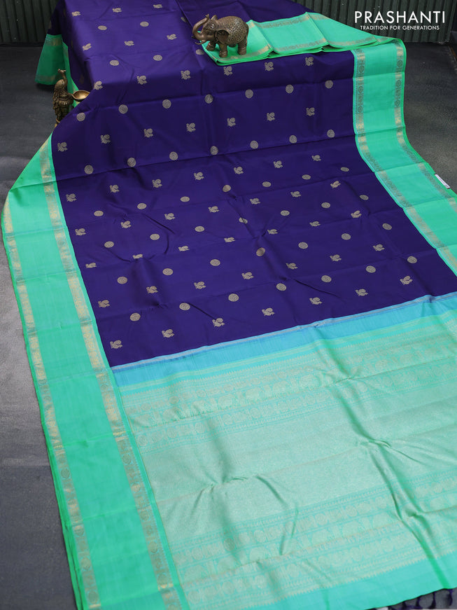 Pure kanchipuram silk saree dark blue and dual shade of teal bluish green with annam & rudhraksha zari woven buttas and rettapet zari woven korvai border