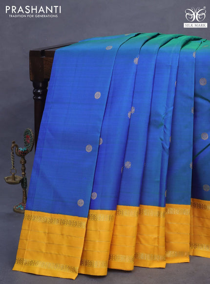 Pure kanchipuram silk saree dual shade of bluish green and yellow with zari woven buttas and rich zari woven korvai border