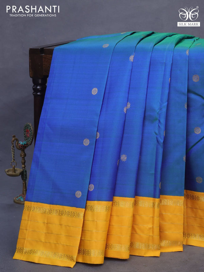 Pure kanchipuram silk saree dual shade of bluish green and yellow with zari woven buttas and rich zari woven korvai border