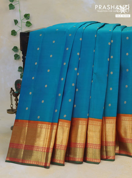 Pure kanchipuram silk saree dual shade of blue and dual shade of mustard with zari woven buttas and zari woven korvai border