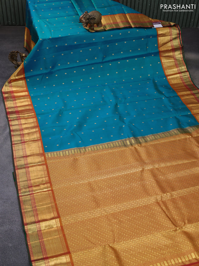 Pure kanchipuram silk saree dual shade of blue and dual shade of mustard with zari woven buttas and zari woven korvai border