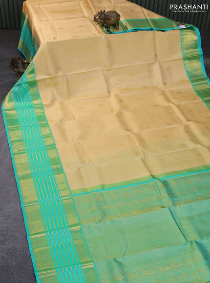 Pure kanchipuram silk saree cream and teal blue with annam zari woven buttas and long rich zari woven korvai border