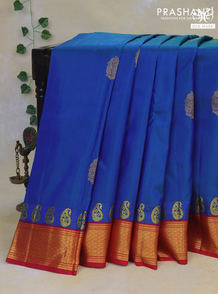 Pure kanchipuram silk saree dual shade of bluish green and pink with zari woven buttas and zari woven korvai border