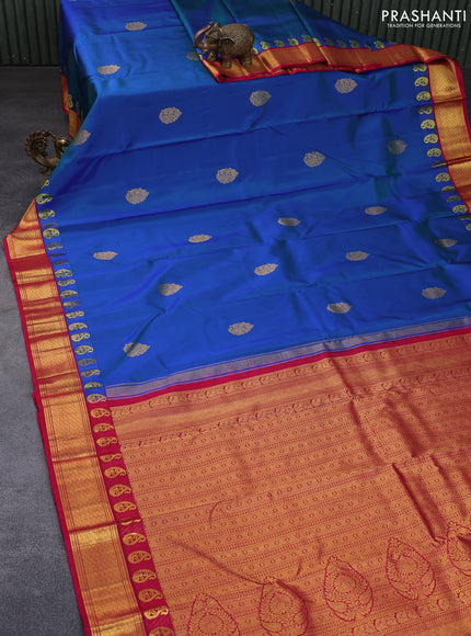 Pure kanchipuram silk saree dual shade of bluish green and pink with zari woven buttas and zari woven korvai border