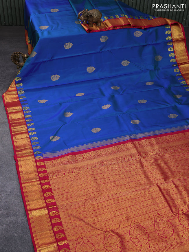 Pure kanchipuram silk saree dual shade of bluish green and pink with zari woven buttas and zari woven korvai border