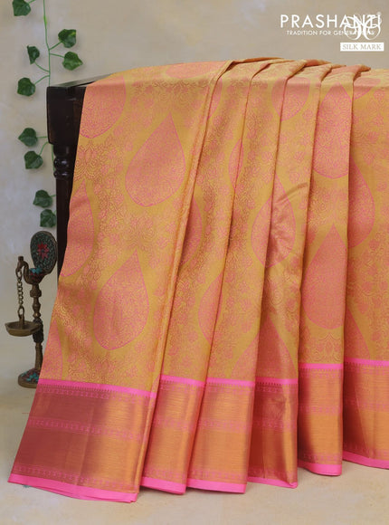 Pure kanchipuram tissue silk saree sandal and candy pink with allover zari brocade weaves and zari woven border