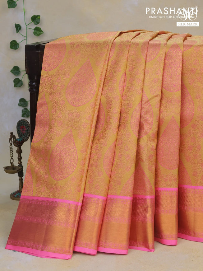 Pure kanchipuram tissue silk saree sandal and candy pink with allover zari brocade weaves and zari woven border