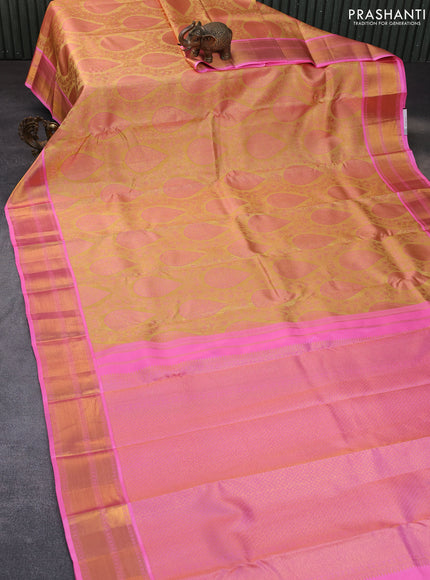 Pure kanchipuram tissue silk saree sandal and candy pink with allover zari brocade weaves and zari woven border