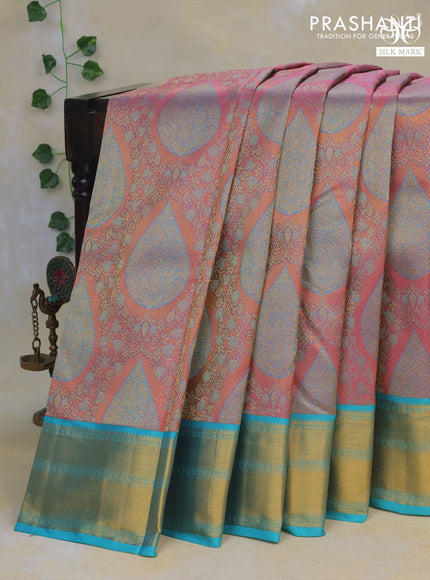 Pure kanchipuram tissue silk saree pastel pink and teal blue with allover zari brocade weaves and zari woven border