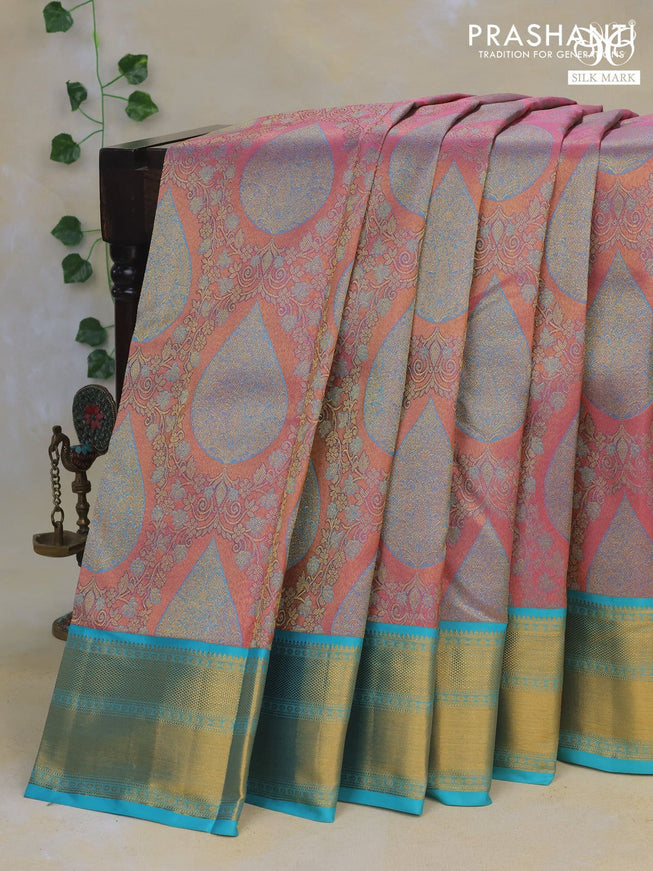 Pure kanchipuram tissue silk saree pastel pink and teal blue with allover zari brocade weaves and zari woven border