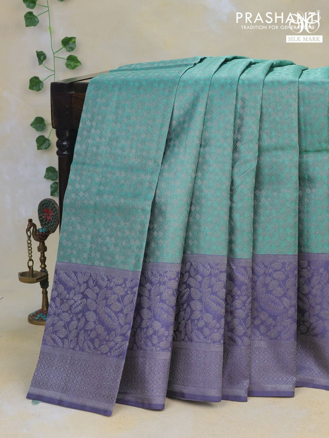 Pure kanchipuram silk saree pastel green and bluish grey with allover silver brocade weaves and long rich silver zari border