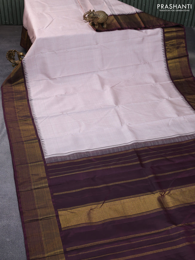 Pure kanchipuram silk saree beige shade and wine shade with allover checked pattern and temple design zari woven border