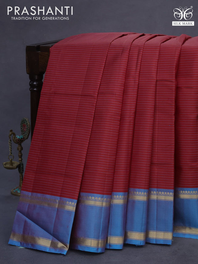 Pure kanchipuram silk saree red and cs blue with allover stripes pattern and rettapet zari woven border