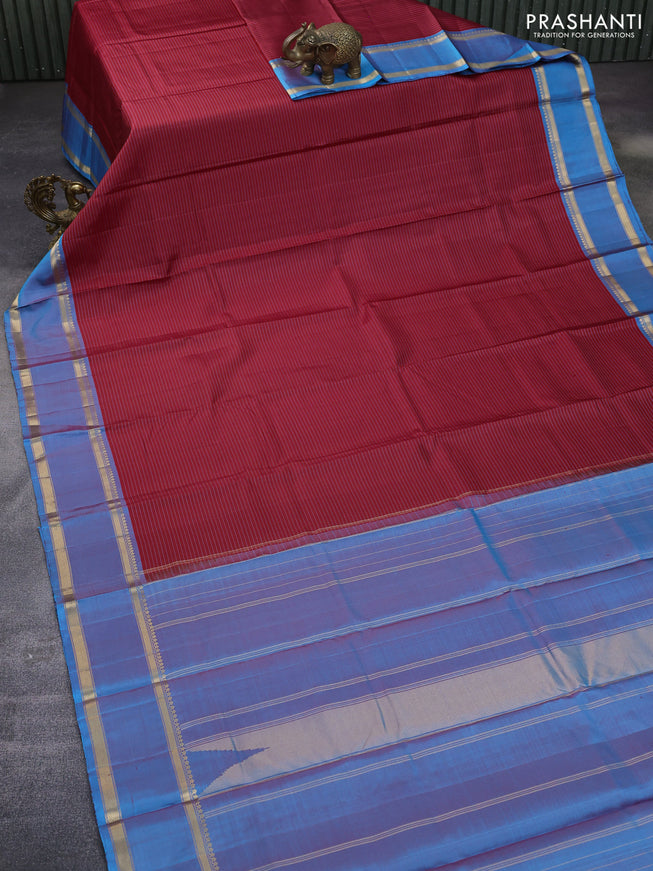 Pure kanchipuram silk saree red and cs blue with allover stripes pattern and rettapet zari woven border