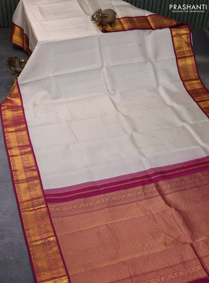 Pure kanchipuram silk saree pastel grey shade and dark magenta pink with zari woven buttas and rich zari woven korvai border