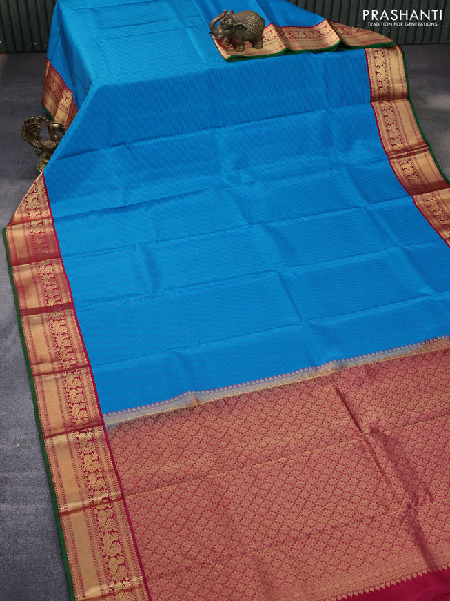 Pure kanchipuram silk saree cs blue and dark pink green with allover stripes pattern and annam zari woven korvai border