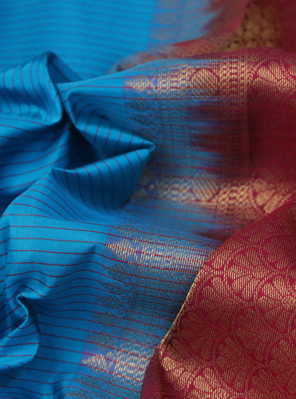 Pure kanchipuram silk saree cs blue and dark pink green with allover stripes pattern and annam zari woven korvai border