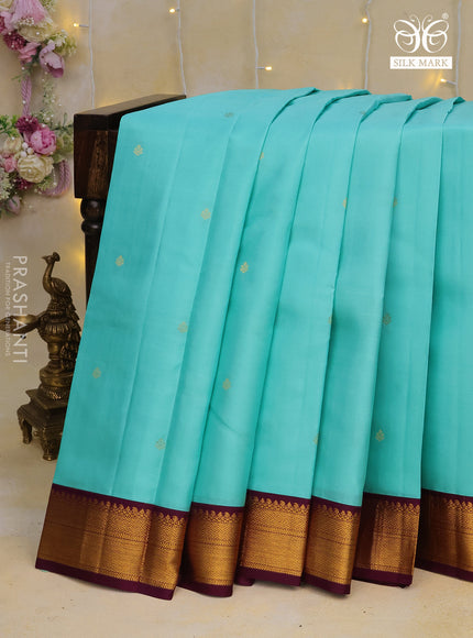 Pure kanchipuram silk saree teal blue and wine shade with zari woven buttas and zari woven korvai border