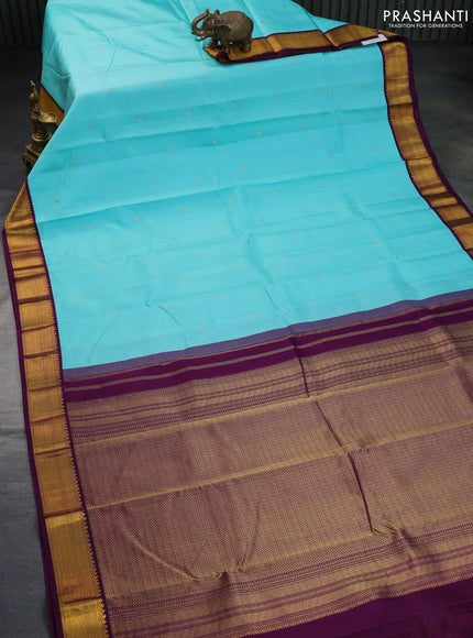 Pure kanchipuram silk saree teal blue and wine shade with zari woven buttas and zari woven korvai border