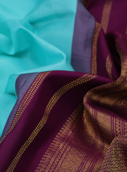 Pure kanchipuram silk saree teal blue and wine shade with zari woven buttas and zari woven korvai border