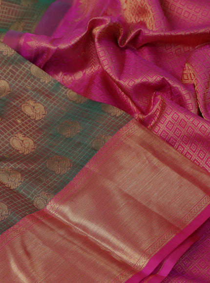 Pure kanchipuram silk saree dual shade of greenish red and pink with allover zari woven brocade weaves and rich zari woven border