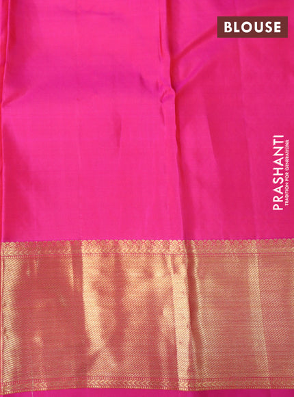 Pure kanchipuram silk saree dual shade of greenish red and pink with allover zari woven brocade weaves and rich zari woven border