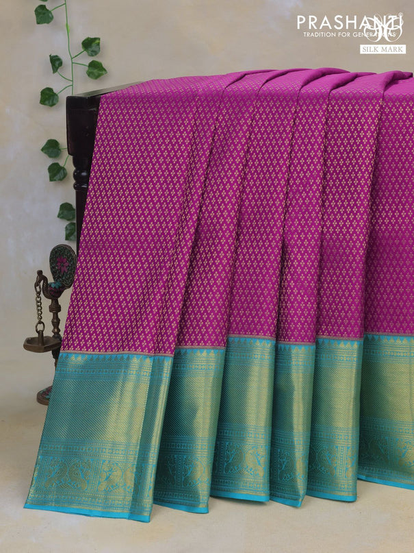 Pure kanchipuram silk saree purple and teal blue with allover zari woven brocade weaves and rich long zari woven border