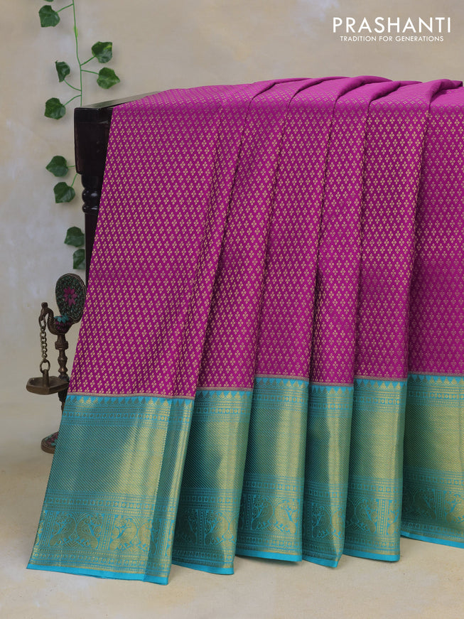 Pure kanchipuram silk saree purple and teal blue with allover zari woven brocade weaves and rich long zari woven border