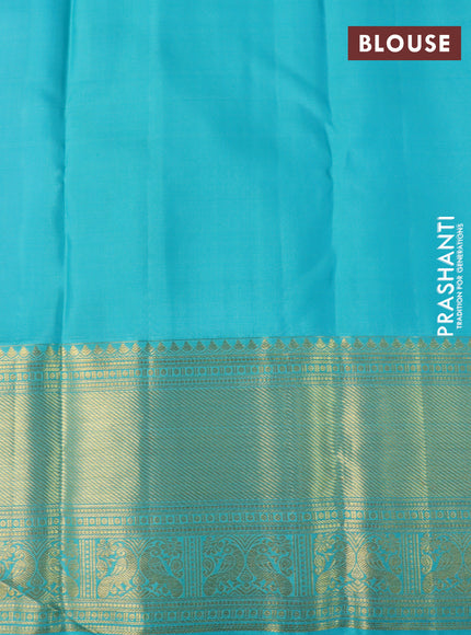 Pure kanchipuram silk saree purple and teal blue with allover zari woven brocade weaves and rich long zari woven border