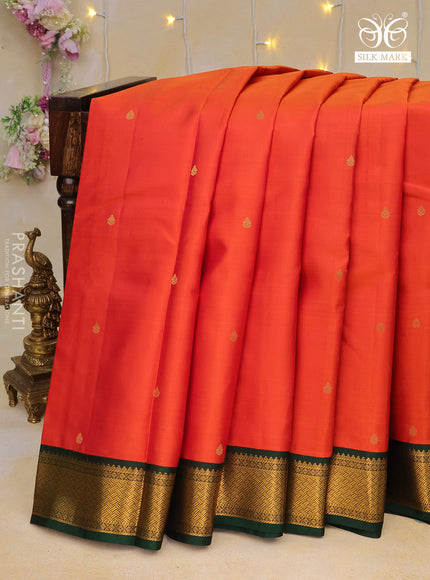 Pure kanchipuram silk saree dual shade of rustic orange and dark green with zari woven buttas and zari woven korvai border