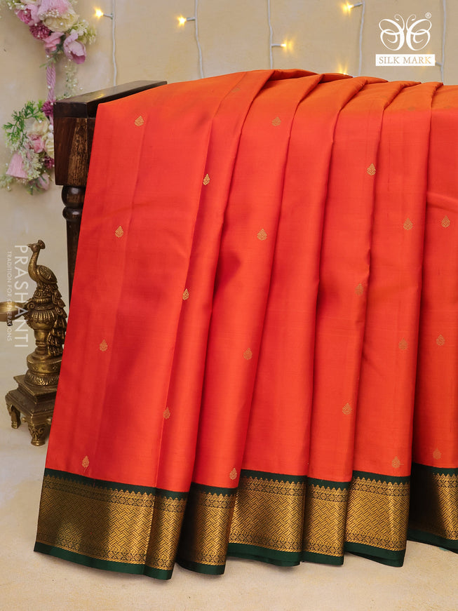 Pure kanchipuram silk saree dual shade of rustic orange and dark green with zari woven buttas and zari woven korvai border