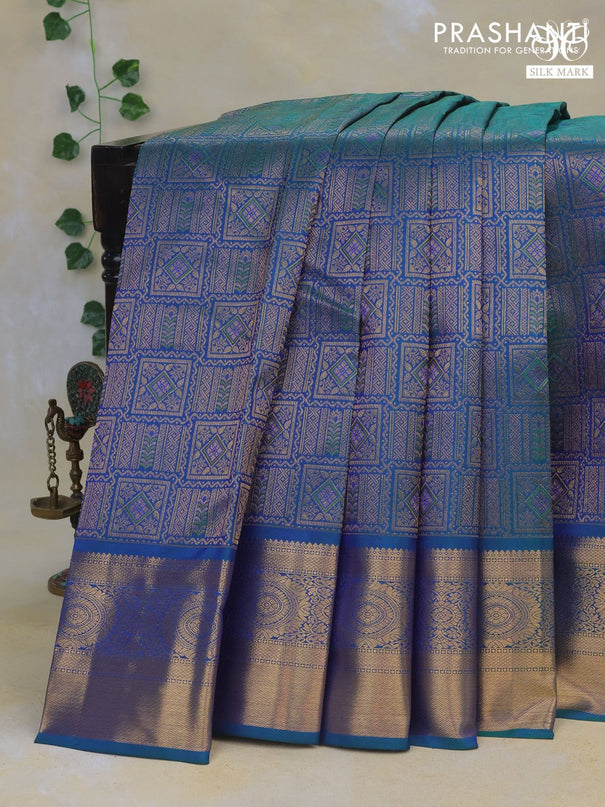 Pure kanchipuram silk saree dual shade of bluish green with allover zari woven brocade weaves and rich zari woven border