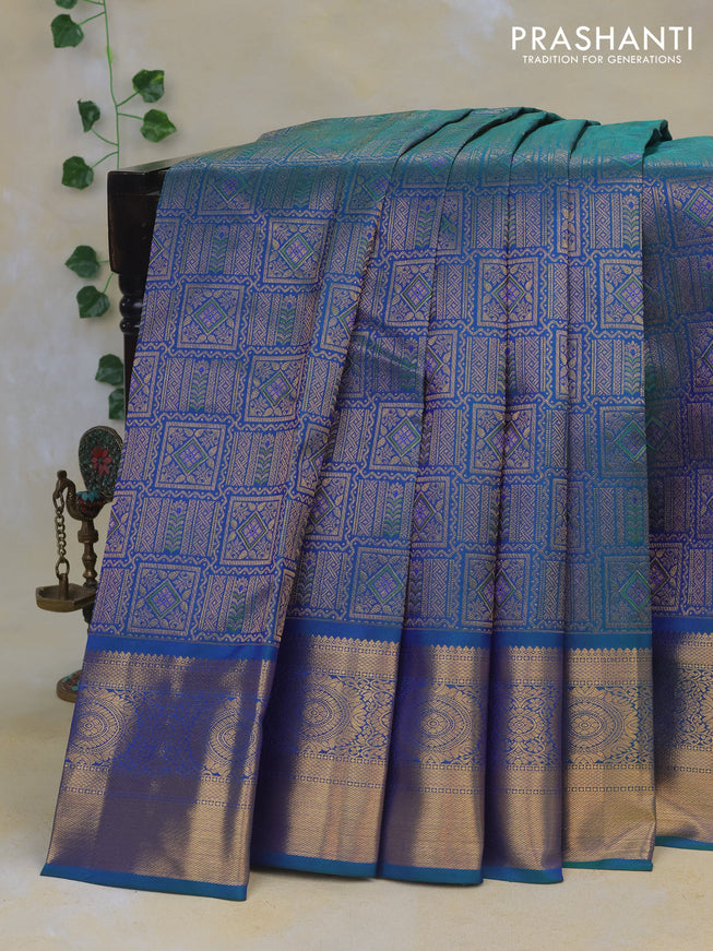 Pure kanchipuram silk saree dual shade of bluish green with allover zari woven brocade weaves and rich zari woven border