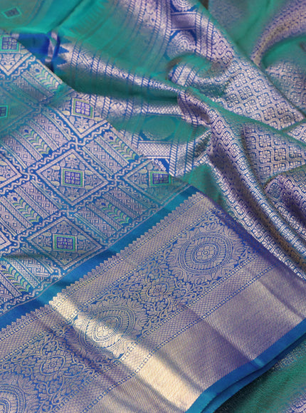 Pure kanchipuram silk saree dual shade of bluish green with allover zari woven brocade weaves and rich zari woven border