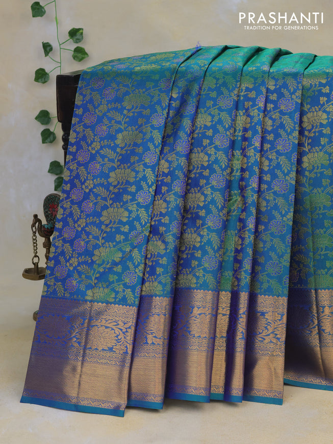 Pure kanchipuram silk saree dual shade of bluish green with allover zari woven floral brocade weaves and long rich zari woven border