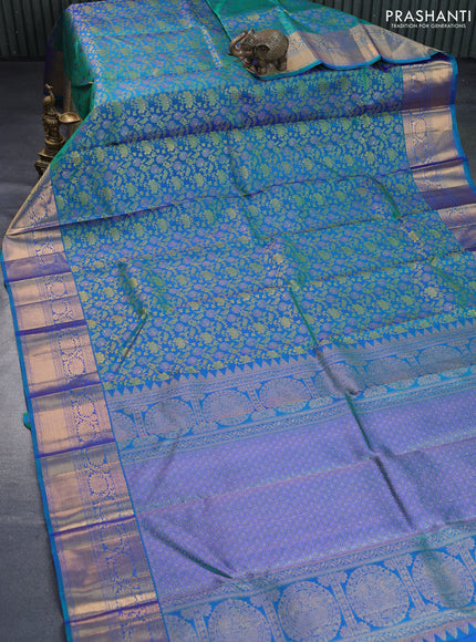 Pure kanchipuram silk saree dual shade of bluish green with allover zari woven floral brocade weaves and long rich zari woven border