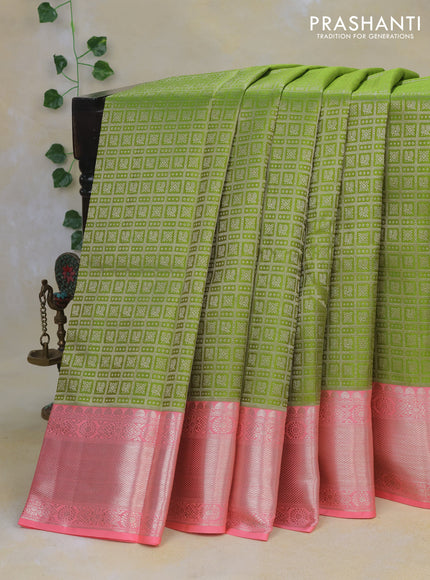 Pure kanchipuram silk saree light green and peach pink with allover zari woven brocade weaves and long rich zari woven border