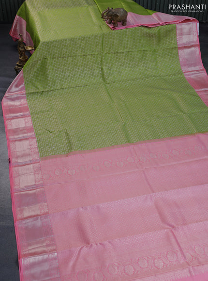 Pure kanchipuram silk saree light green and peach pink with allover zari woven brocade weaves and long rich zari woven border