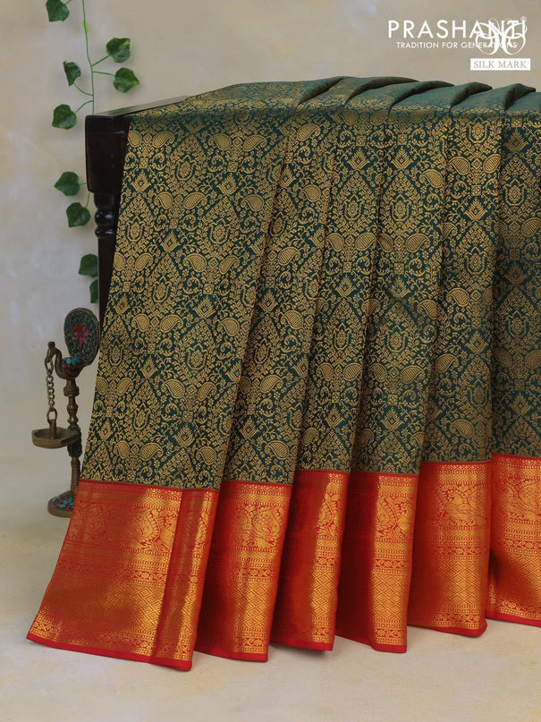 Pure kanchipuram silk saree bottle green and red with allover zari woven brocade weaves and rich zari woven border