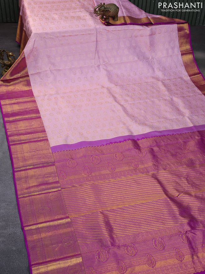 Pure kanchipuram silk saree light pink and purple with allover zari woven floral brocade weaves and long rich zari woven border