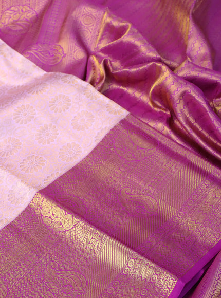 Pure kanchipuram silk saree light pink and purple with allover zari woven floral brocade weaves and long rich zari woven border