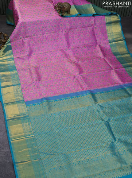 Pure kanchipuram silk saree lotus pink and teal blue with allover zari woven floral brocade weaves and rich zari woven border