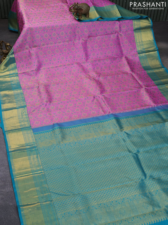 Pure kanchipuram silk saree lotus pink and teal blue with allover zari woven floral brocade weaves and rich zari woven border