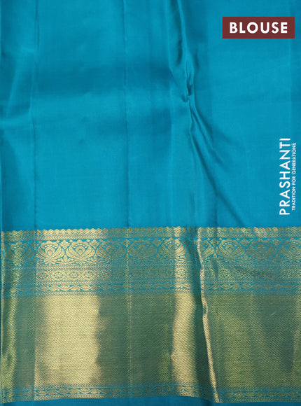 Pure kanchipuram silk saree lotus pink and teal blue with allover zari woven floral brocade weaves and rich zari woven border